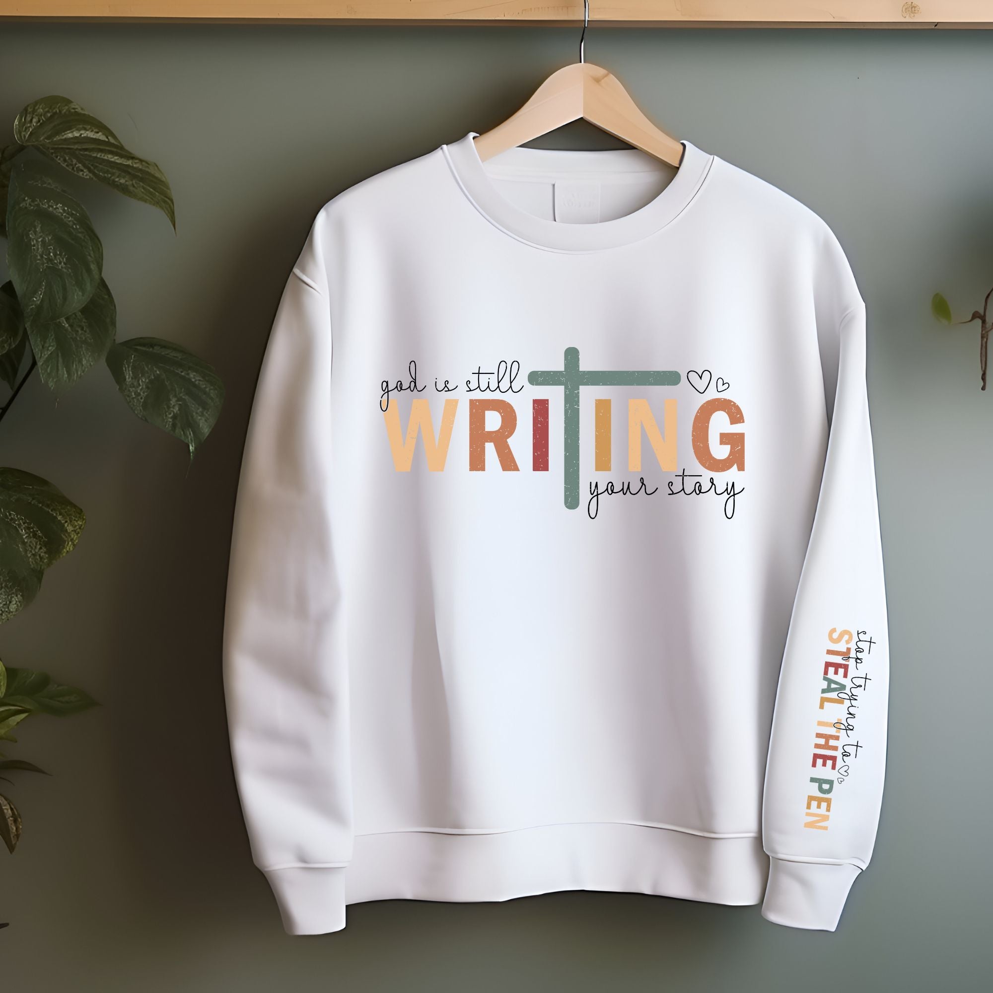 God Is Still Writing Your Story Sweatshirt - Sleeve Print